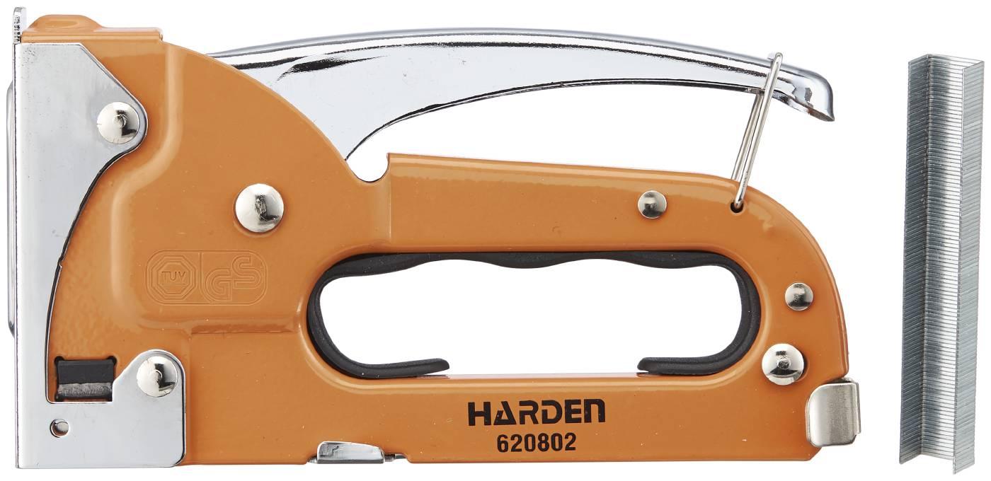 Harden manuell häftpistol med orange metallhus och klammer